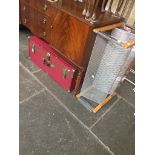 A vintage Seward travel trunk and a shoe rack