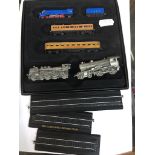 A small cased train presentation set and 2 pewter trains Catalogue only, live bidding available
