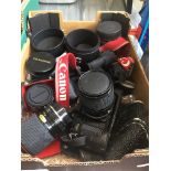 A box containing a Canon A-1 camera and various lenses, including Canon and Konica Catalogue only,