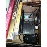 A radar detector, radio and a few books Catalogue only, live bidding available via our website. If