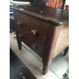 An old commode in shape of small chest of drawers. Catalogue only, live bidding available via our