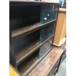A bookcase with glass sliding doors Catalogue only, live bidding available via our website. Please