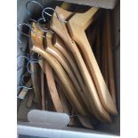 A box of wooden hangers. Catalogue only, live bidding available via our website. Please note if