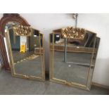 A pair of continental mirrors with gilded flower decoration to frames, 93cm x 66cm each (inc