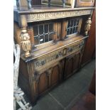 An oak court cupboard Catalogue only, live bidding available via our website. Please note if you