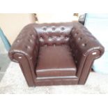 A Chesterfield brown faux leather tub chair Catalogue only, live bidding available via our