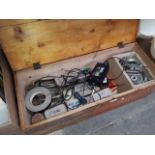 A wooden box of mixed tins with garage items Catalogue only, live bidding available via our website.