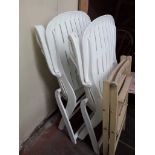 A pair of white plastic reclining chairs Catalogue only, live bidding available via our website.