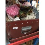 A vintage case containing mainly scarves, clothing patterns, etc. Catalogue only, live bidding