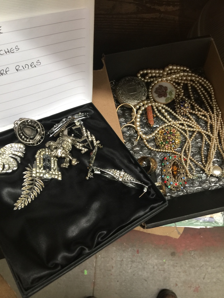 Two small boxes with costume jewellery brooches, rings, necklaces, etc Catalogue only, live
