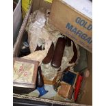 A box of items inc old linen, wall mounted brush set, etc Catalogue only, live bidding available via