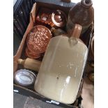 A box containing stoneware flagons and copper jelly moulds Catalogue only, live bidding available