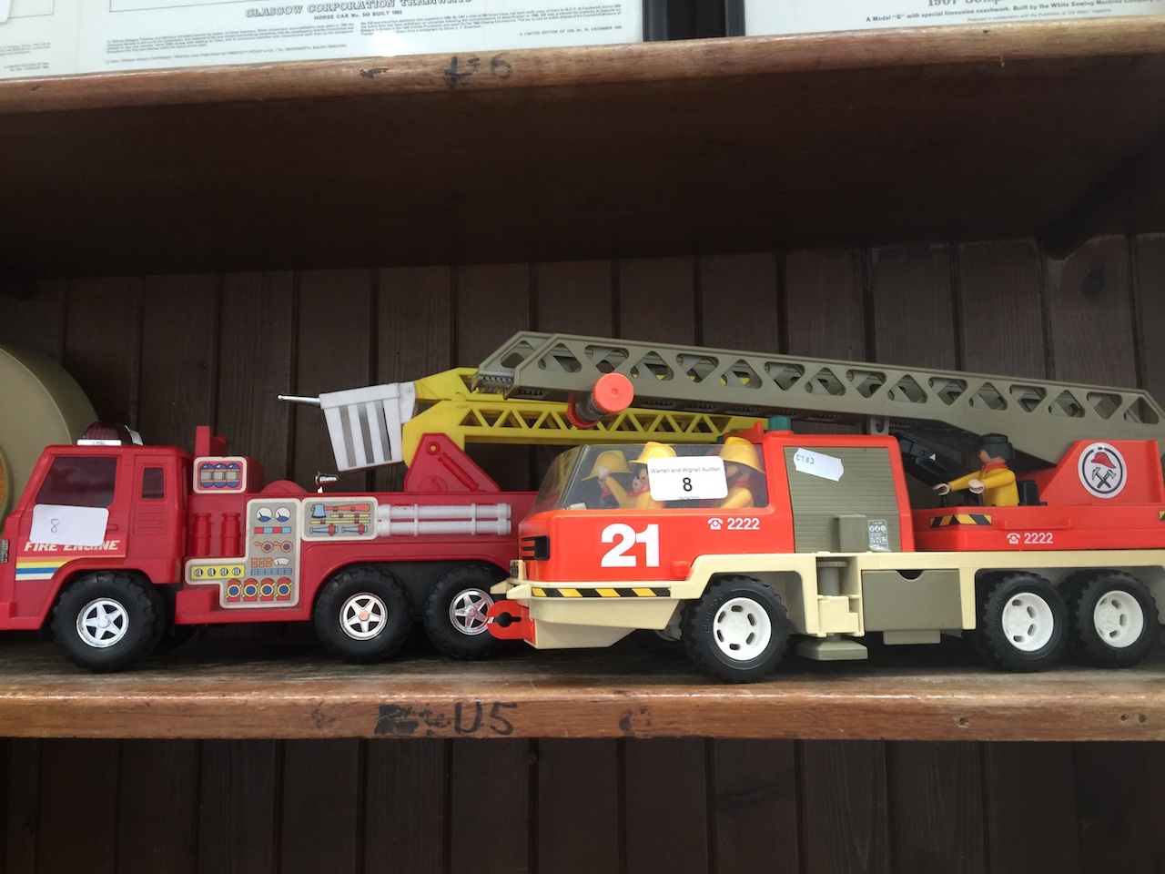 A Playmobil ladder truck and a fire engine. Catalogue only, live bidding available via our