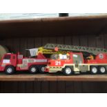 A Playmobil ladder truck and a fire engine. Catalogue only, live bidding available via our