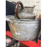 A galvanized baby bath and watering can. Catalogue only, live bidding available via our website.