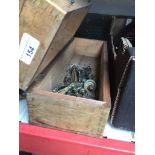 A wooden box containing vintage brass handles for furniture. Catalogue only, live bidding