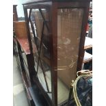 A glazed display cabinet with claw and ball feet Catalogue only, live bidding available via our
