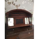 An Edwardian carved mahogany mirror back wall hanging shelf Catalogue only, live bidding available