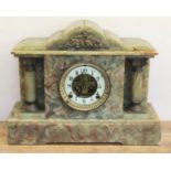 A late Victorian architectural onyx mantle clock with visible escapement, length 40cm.