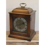 A walnut cased mantle clock.