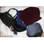 A box of vintage linen and purses/handbags