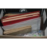 A box of stamp albums and loose stamps