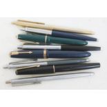 A group of three vintage Parker fountain pens & five Papermate ballpoint pens.