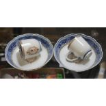 A pair of Chinese export porcelain cups and saucers with armorial monogram, from the estate of the