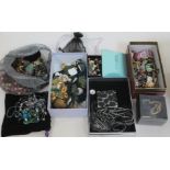 A bag and various boxes of costume jewellery.