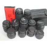 A box of mainly camera lenses including Canon, Sigma, Hoya etc.
