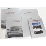 Porsche 911 ephemera comprising four brochures and The Porsche Driving Book by Martin Beck-
