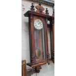 A late 19th century weight driven walnut Vienna wall clock, length 123cm, (no weights).