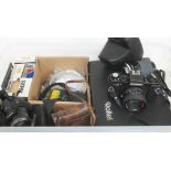 A box of cameras and camera equipment including a Braun Paxina, a Fujifilm Finepix S digital