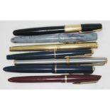 A group of seven vintage fountain pens including two with nibs marked '14k', another marked 'iridium