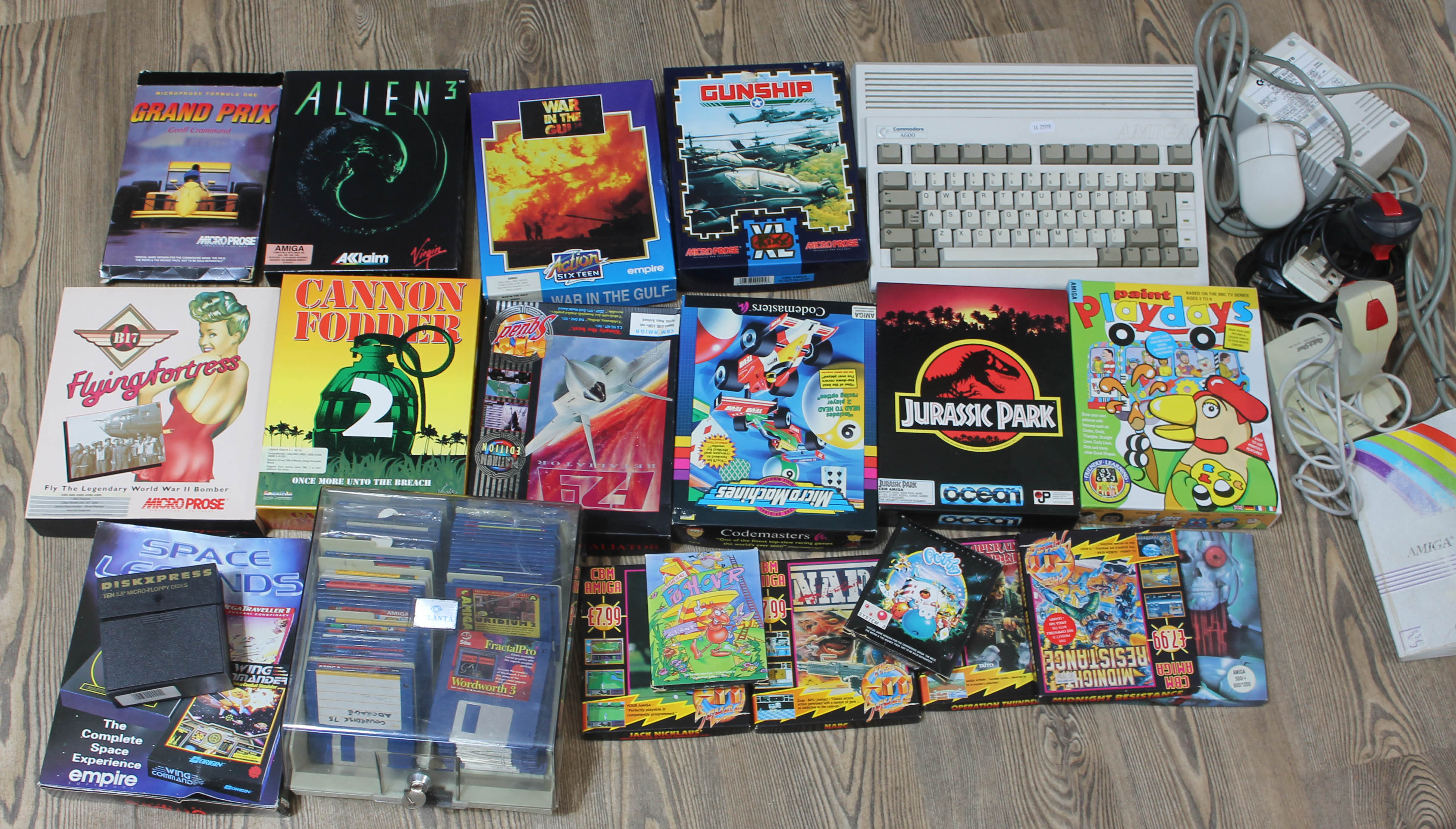 A Commodore Amiga A600 console and collection of games.