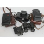 A mixed lot of cameras and binoculars including Brownie, Zorki, Kodak etc.
