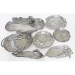 A group of seven reproduction Art Nouveau style pewter trays.