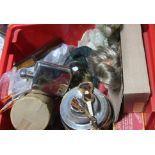 A mixed crate of items including biscuit barrel, dolls, clock under plastic dome, gents travel