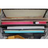 A bag and small tub of stamp albums and loose stamps