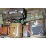 A box of collectable items including wooden 2 bias bowls, field binoculars, coins, autograph