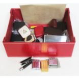 A box containing vintage lighters and cufflinks etc.