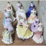 A group of thirteen porcelain ladies comprising five Coalport, five Royal Doulton and three Royal