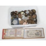 A tub of world coins and banknotes.