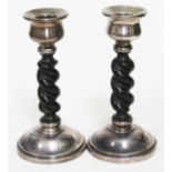 A pair of hallmarked silver and ebony barley twist candlesticks, CP & Co Chester 1928, height 16cm.