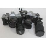 A Praktica MTL3 camera, a Praktica Nova I camera and three lenses.