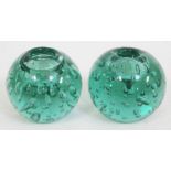 A pair of Victorian bubble glass ink well or paperweights.