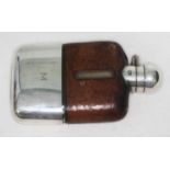 A silver plated and leather bound hip flask, length 11.5cm.