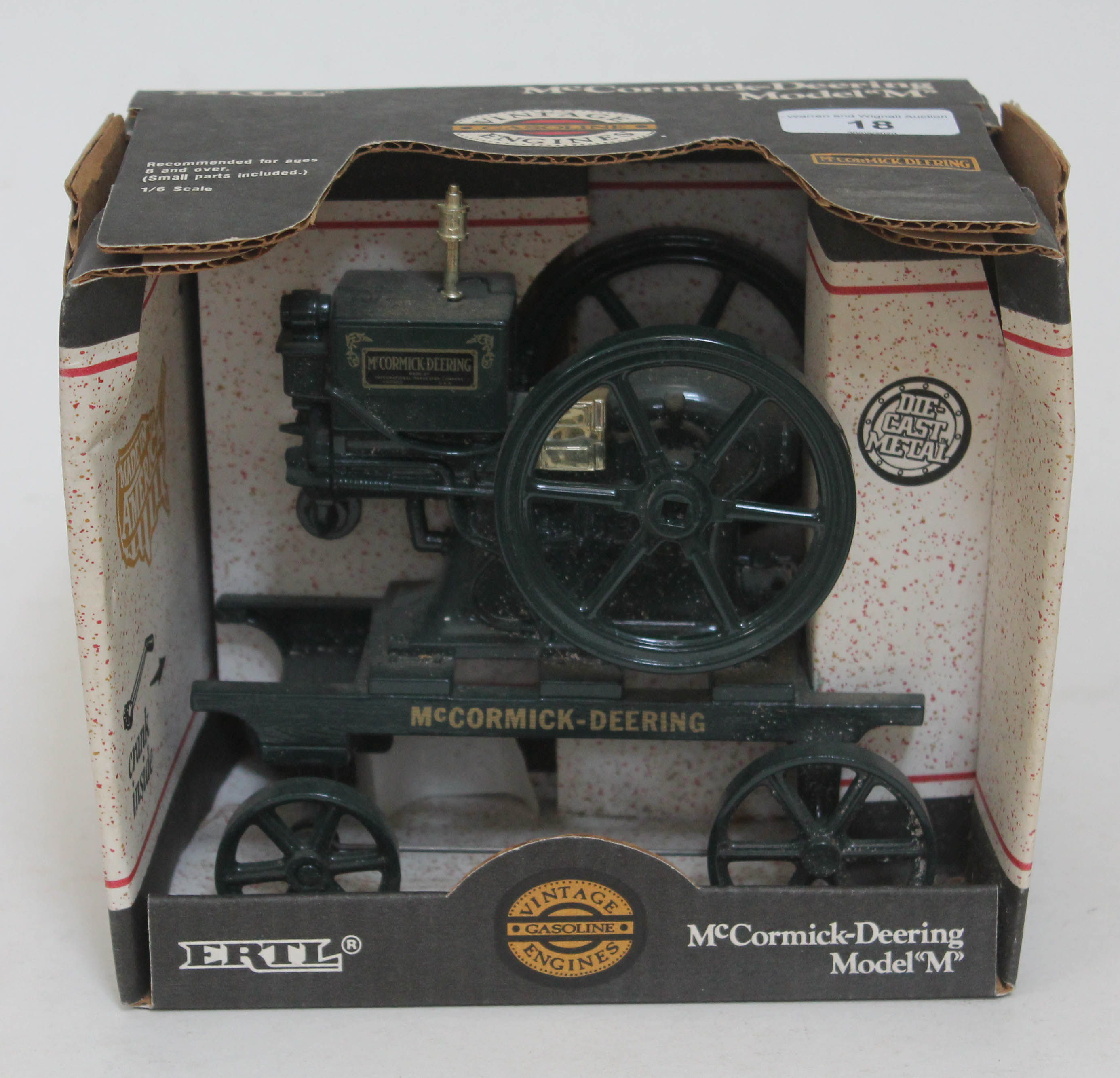 An Ertl McCormick-Deering Model "M" die-cast model in original box.