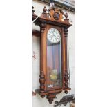 A late 19th century walnut cased weight driven Vienna wall clock by Gustav Becker, length 125cm.
