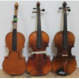 A group of three violins, spares and repairs.